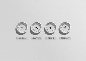 A photo of four clocks showing the timezones in London, New York, Tokyo and Moscow 