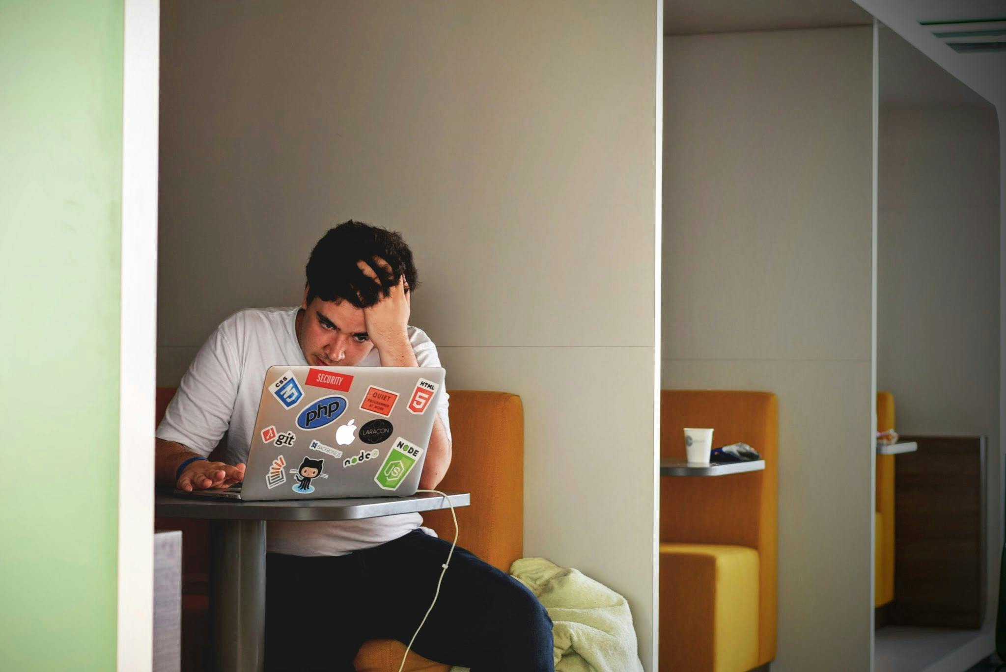 A guy sitting at his laptop working